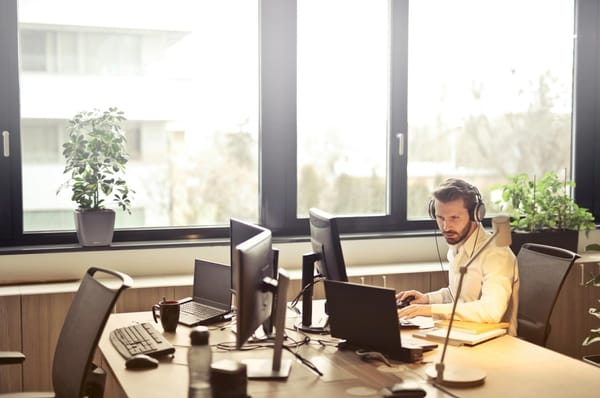 A typical day in the office showing a picture of a trader buying and selling call options.